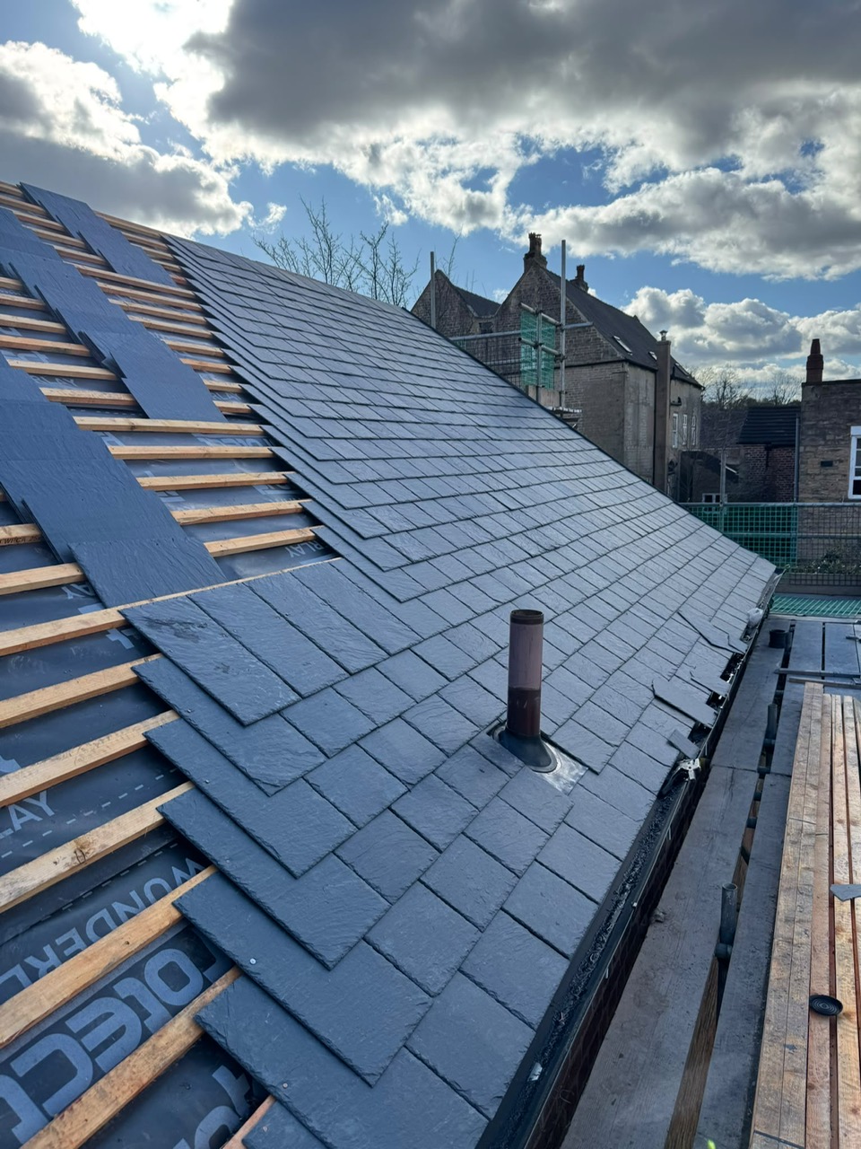 Slate roofing in progress